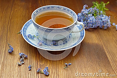 Forget me nots with old china tea cup Stock Photo