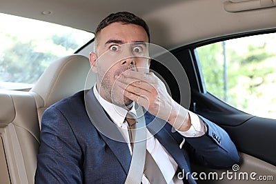 Forgetful businessman feeling panic in taxi Stock Photo