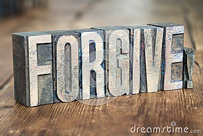 Forgive word wood Stock Photo