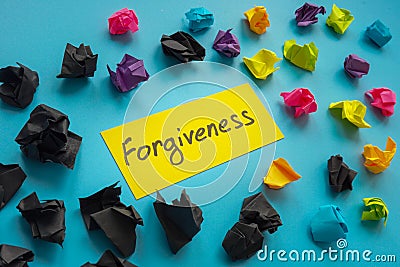 Forgiveness word about relationship and paper balls. Stock Photo