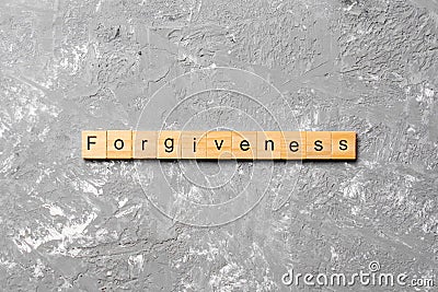 Forgiveness word written on wood block. forgiveness text on table, concept Stock Photo