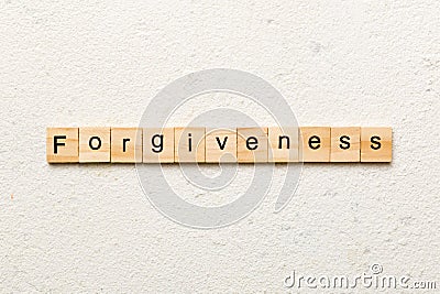 forgiveness word written on wood block. forgiveness text on table, concept Stock Photo