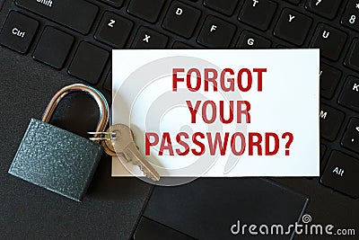 Forgot your password - the inscription on the card and the lock on the background of the keyboard Stock Photo