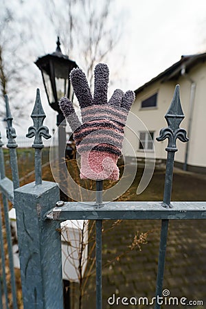 Forgotten children`s knitted glove. Stock Photo