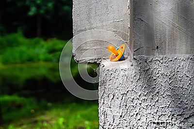 The forgotten children's nipple lies on the parapet of the fence. Stock Photo