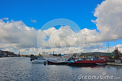 The forgotten harbor in Ghent, living boats and factories Editorial Stock Photo