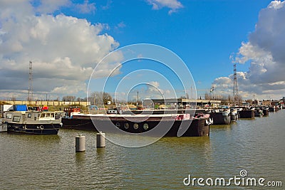 The forgotten harbor in Ghent, living boats and factories Editorial Stock Photo