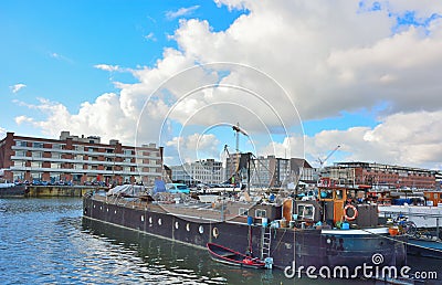 The forgotten harbor in Ghent, living boats and factories Editorial Stock Photo