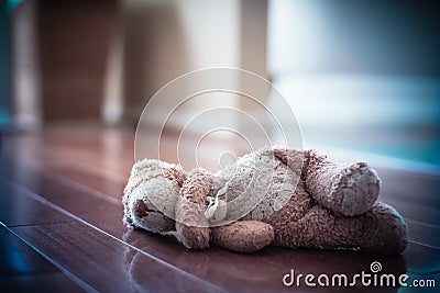 Forgotten Teddy Bear on the Floor Stock Photo