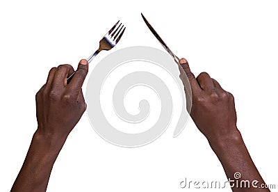 Fork and knife being held by mans hands Stock Photo