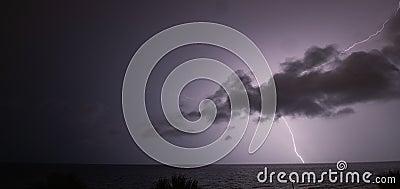 Fork Lightning Over A Body Of Water. Stock Photo