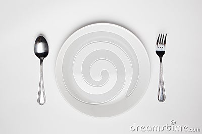Fork and spoon and empty plate Stock Photo