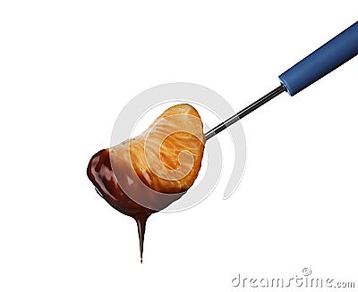 Fork with tangerine segment dipped into chocolate fondue Stock Photo