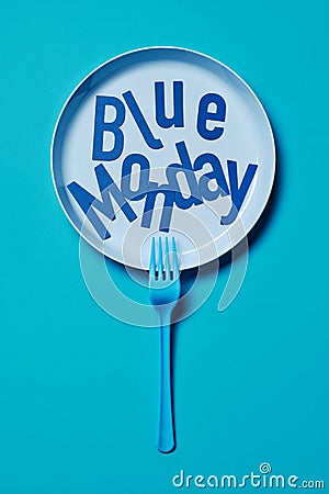 Fork and text blue monday in a blue plate Stock Photo