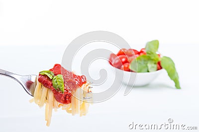 Forkful with succulent and tasty spaghetti with tomato sauce Stock Photo