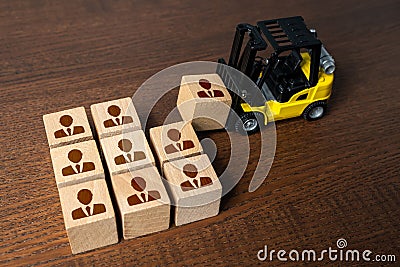 Forklift builds a team of people. Recruitment seeking to fill job openings Putting people in their places. Opening of new jobs. Stock Photo