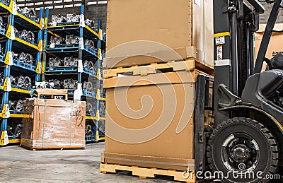 Forklift cardboard boxes in a store warehouse automotive part Stock Photo