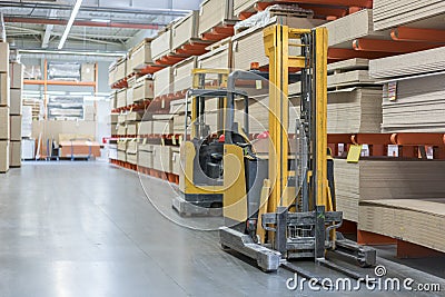 forklift in a construction shop. Construction Materials. Stacking truck in wholesale warehouse Stock Photo