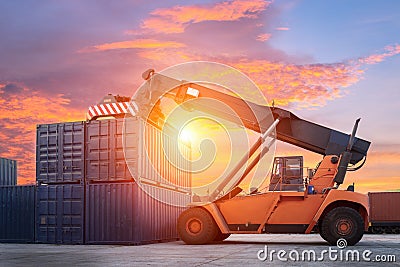Forklift handling container box loading to freight train in import, export Stock Photo