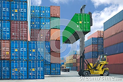 forklift handling container box loading to truck in import export logistic zone Stock Photo