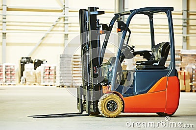 Forklift loader stacker truck at warehouse Stock Photo