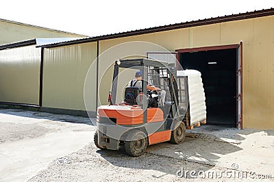 Forklift move cargo from warehouse Editorial Stock Photo