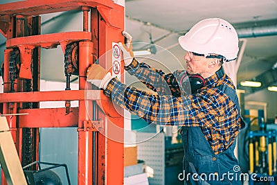 Forklift Repairing Work Stock Photo