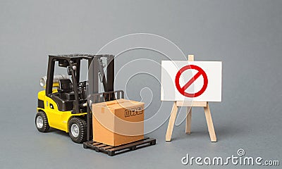 Forklift truck carries a cardboard box near a stand with a red symbol NO. No delivery. Restriction on the importation of goods Stock Photo
