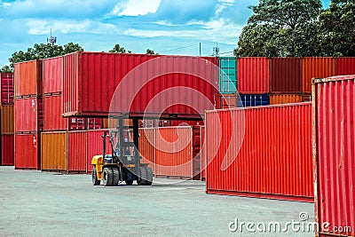 Forklift truck lifting cargo container Stock Photo