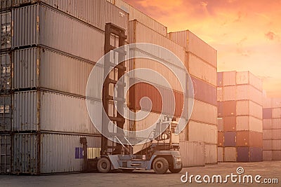 Forklift truck lifting cargo container in shipping yard Stock Photo