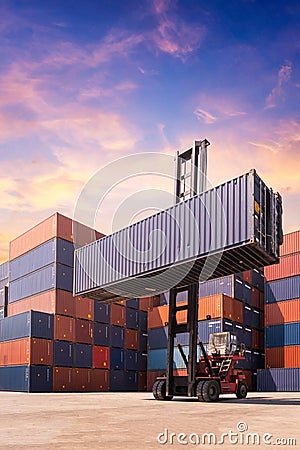 Forklift truck lifting cargo container in shipping yard Stock Photo