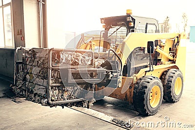 Forklift truck. Waste processing plant. Technological process. Recycling and storage of waste for further disposal Stock Photo