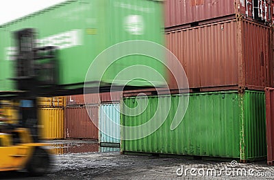 Forklift unloading a container box Stock Photo