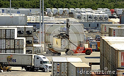 Forklift unloading larger containers Editorial Stock Photo