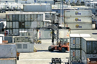 Forklift unloading larger containers Editorial Stock Photo