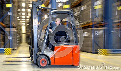 Forklift in warehouse Stock Photo