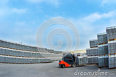 Forklift work in the warehouse for the production of concrete blocks Stock Photo