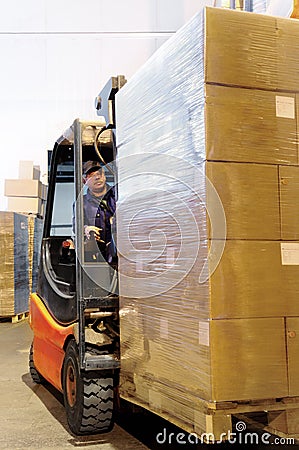 Forklift worker in loader at Stock Photo