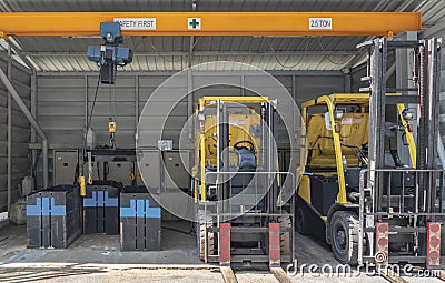 Forklifts parked to charge batteries Editorial Stock Photo