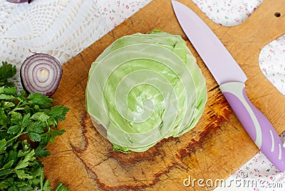 Forks young cabbage on a cutting board and knife Stock Photo