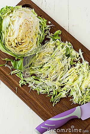 Forks young cabbage on a cutting board and knife Stock Photo