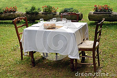 Formal table setting on a private lawn Stock Photo