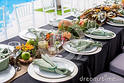 Formal Thanksgiving table and chavari chairs in the fall family gathering for holiday dinner Stock Photo