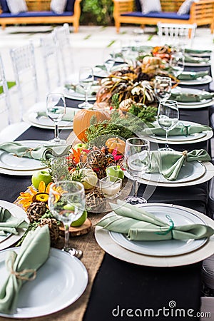 Formal Thanksgiving table and chavari chairs in the fall family group for holiday dinner Stock Photo