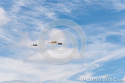Formation flying of three old biplane aircrafts during air show Editorial Stock Photo