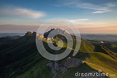 The formation and movements of clouds up to the steep slopes of the mountains of Central Caucasus peaks. Stock Photo