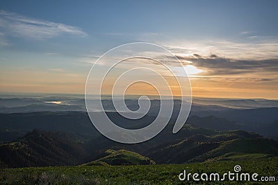 The formation and movements of clouds up to the steep slopes of the mountains of Central Caucasus peaks. Stock Photo