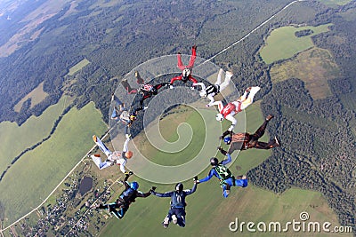 Formation skydiving. Skydivers have done a circle in the sky. Editorial Stock Photo