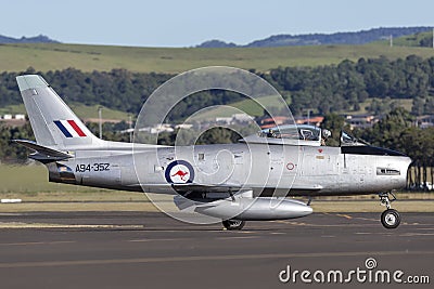 Former Royal Australian Air Force RAAF Commonwealth Aircraft Corporation CA-27 North American F-86 Sabre jet aircraft flying Editorial Stock Photo