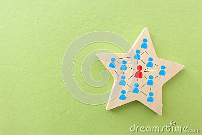 forming a successful team, people icons over wooden star, human resources, and management concept Stock Photo